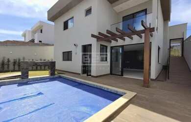 Imagem: A casa possui 4 Dormitórios, 5 Banheiros, 4 Vagas na garagem