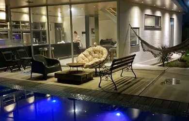 Imagem: A casa em condomínio possui 4 Dormitórios, 4 Banheiros, 2