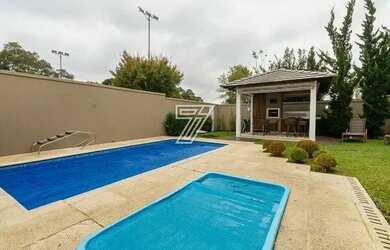 Imagem: A casa em condomínio possui 4 Dormitórios, 5 Banheiros, 4