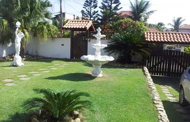 Imagem: A casa possui 3 Dormitórios, 3 Banheiros, 4 Vagas na garagem