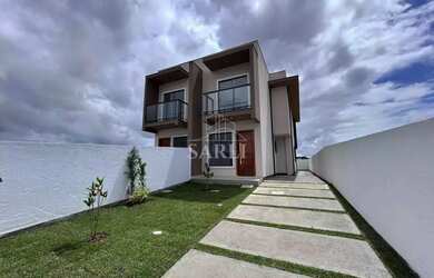 Imagem: A casa possui 3 Dormitórios, 3 Banheiros, 2 Vagas na garagem