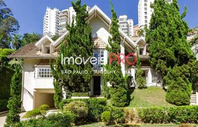 Imagem: A casa possui 4 Dormitórios, 5 Banheiros, 5 Vagas na garagem