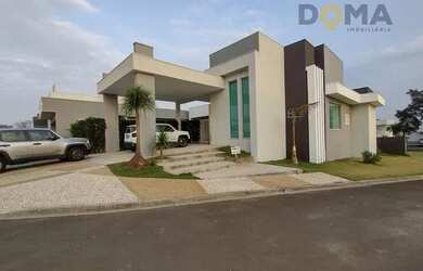 Imagem: A casa possui 3 Dormitórios, 5 Banheiros, 4 Vagas na garagem