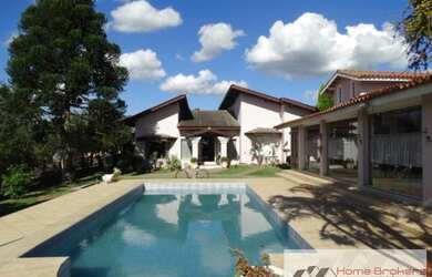 Imagem: A casa em condomínio possui 5 Dormitórios, 5 Banheiros, 4