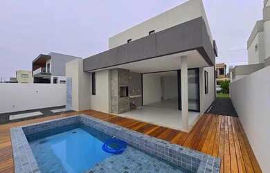 Imagem: A casa em condomínio possui 4 Dormitórios, 5 Banheiros, 198m²