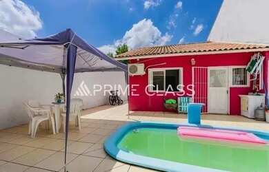 Imagem: A casa possui 2 Dormitórios, 2 Banheiros, 3 Vagas na garagem