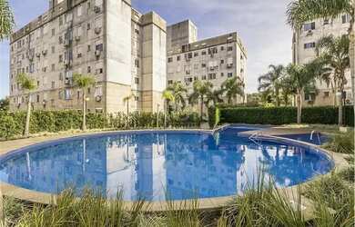 Imagem: O apartamento possui 2 Dormitórios, 1 Banheiro, 1 Vaga na garagem