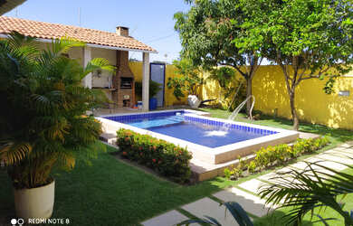 Imagem: A casa possui 3 Dormitórios, 3 Vagas na garagem e está localizado