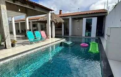 Imagem: A casa possui 4 Dormitórios, 5 Banheiros, 5 Vagas na garagem