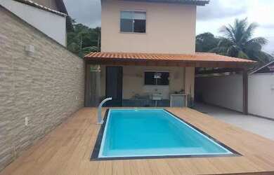 Imagem: A casa possui 2 Dormitórios, 4 Banheiros, 4 Vagas na garagem