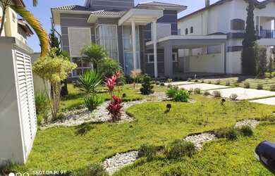 Imagem: A casa possui 3 Dormitórios, 5 Banheiros, 5 Vagas na garagem