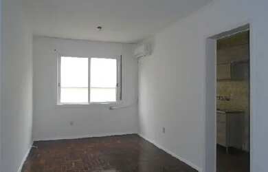 Imagem: O apartamento possui 1 Dormitório, 1 Banheiro, 1 Vaga na garagem