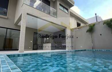 Imagem: A casa possui 4 Dormitórios, 4 Banheiros, 4 Vagas na garagem