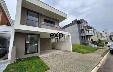 Imagem: A casa possui 3 Dormitórios, 3 Banheiros, 2 Vagas na garagem