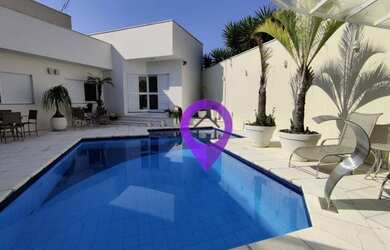 Imagem: A casa possui 5 Dormitórios, 5 Banheiros, 5 Vagas na garagem