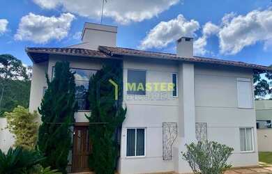 Imagem: A casa possui 4 Dormitórios, 4 Banheiros, 4 Vagas na garagem