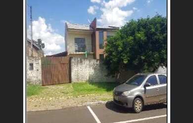 Imagem: A casa possui 3 Dormitórios, 1 Banheiro, 1 Vaga na garagem