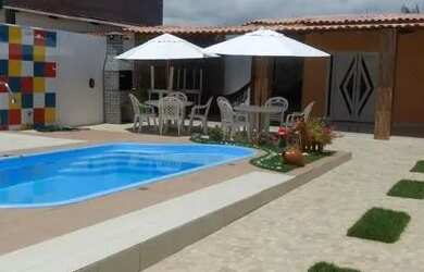 Imagem: A casa possui 3 Dormitórios e 3 Vagas na garagem e está localizado