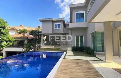 Imagem: A casa possui 5 Dormitórios, 5 Banheiros, 5 Vagas na garagem