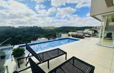 Imagem: A casa em condomínio possui 4 Dormitórios, 5 Banheiros, 4