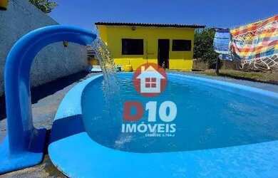 Imagem: A casa possui 2 Dormitórios, 1 Banheiro, 2 Vagas na garagem