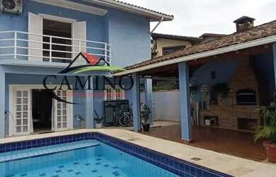 Imagem: A casa possui 4 Dormitórios, 3 Banheiros, 3 Vagas na garagem