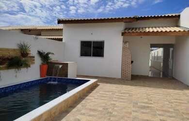 Imagem: A casa possui 3 Dormitórios, 3 Banheiros, 3 Vagas na garagem