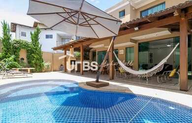 Imagem: A casa possui 4 Dormitórios, 5 Banheiros, 4 Vagas na garagem