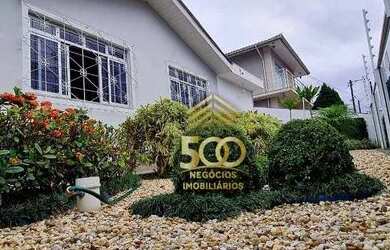 Imagem: A casa possui 2 Dormitórios, 3 Banheiros, 4 Vagas na garagem