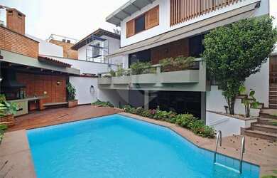 Imagem: A casa possui 4 Dormitórios, 5 Banheiros, 5 Vagas na garagem