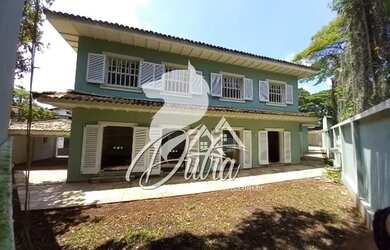 Imagem: A casa possui 4 Dormitórios, 4 Banheiros, 4 Vagas na garagem