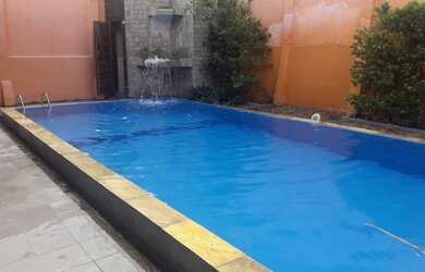 Imagem: A casa possui 5 Dormitórios, 5 Banheiros, 2 Vagas na garagem