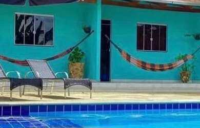 Imagem: A casa possui 4 Dormitórios, 5 Banheiros, 5 Vagas na garagem