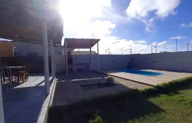 Imagem: A casa possui 3 Dormitórios, 5 Vagas na garagem e está localizado