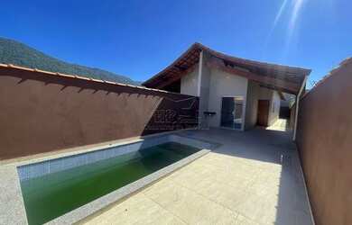 Imagem: A casa possui 2 Dormitórios, 2 Banheiros, 3 Vagas na garagem