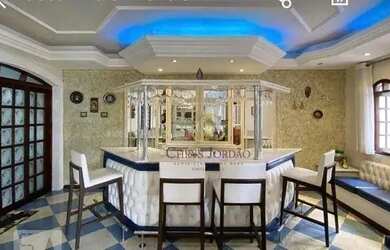 Imagem: A casa possui 3 Dormitórios, 5 Banheiros, 5 Vagas na garagem