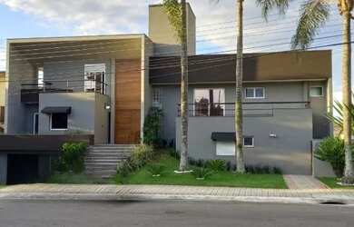 Imagem: A casa em condomínio possui 4 Dormitórios, 5 Banheiros, 4