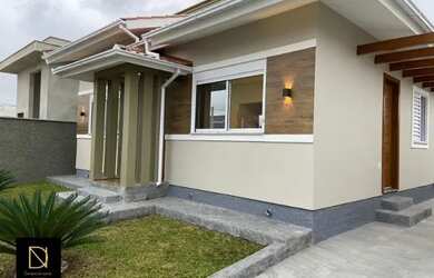 Imagem: A casa possui 3 Dormitórios, 3 Banheiros, 3 Vagas na garagem