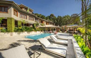 Imagem: A casa em condomínio possui 4 Dormitórios, 5 Banheiros, 5