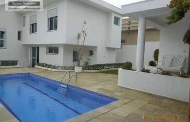 Imagem: A casa em condomínio possui 5 Dormitórios, 5 Banheiros, 4