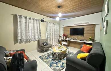 Imagem: A casa possui 3 Dormitórios, 4 Banheiros, 5 Vagas na garagem