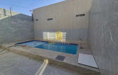 Imagem: A casa possui 3 Dormitórios, 3 Banheiros, 4 Vagas na garagem