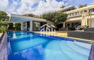 Imagem: A casa possui 5 Dormitórios, 5 Banheiros, 5 Vagas na garagem