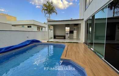 Imagem: A casa possui 4 Dormitórios, 5 Banheiros, 4 Vagas na garagem