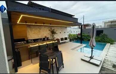 Imagem: A casa possui 4 Dormitórios, 3 Banheiros, 5 Vagas na garagem