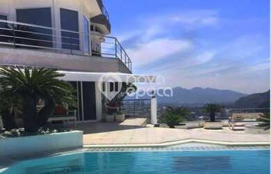 Imagem: A casa possui 4 Dormitórios, 5 Banheiros, 5 Vagas na garagem