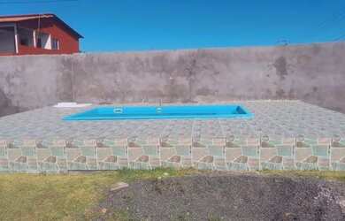 Imagem: A casa possui 3 Dormitórios, 2 Banheiros, 3 Vagas na garagem