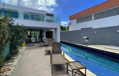 Imagem: A casa possui 3 Dormitórios, 5 Banheiros, 5 Vagas na garagem