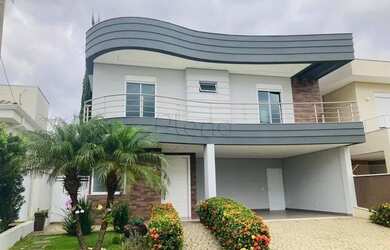 Imagem: A casa possui 4 Dormitórios, 5 Banheiros, 4 Vagas na garagem