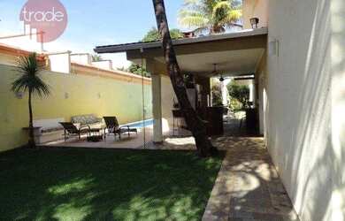 Imagem: A casa possui 3 Dormitórios, 3 Banheiros, 4 Vagas na garagem